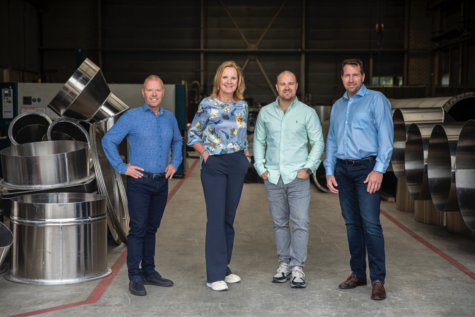 The management team of Heat Matrix poses in the workshop: Peter van Veelen, Martine Goedegebuure, Rik Kuenen, and Cor de Leeuw.