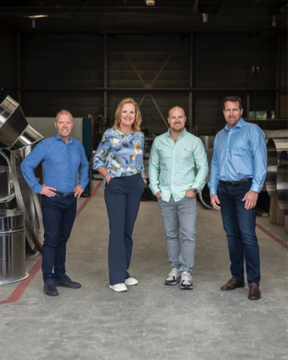 The management team of Heat Matrix poses in the workshop: Peter van Veelen, Martine Goedegebuure, Rik Kuenen, and Cor de Leeuw.
